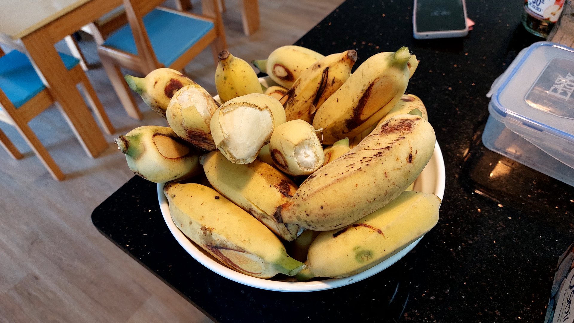 A bowl of small bananas at school