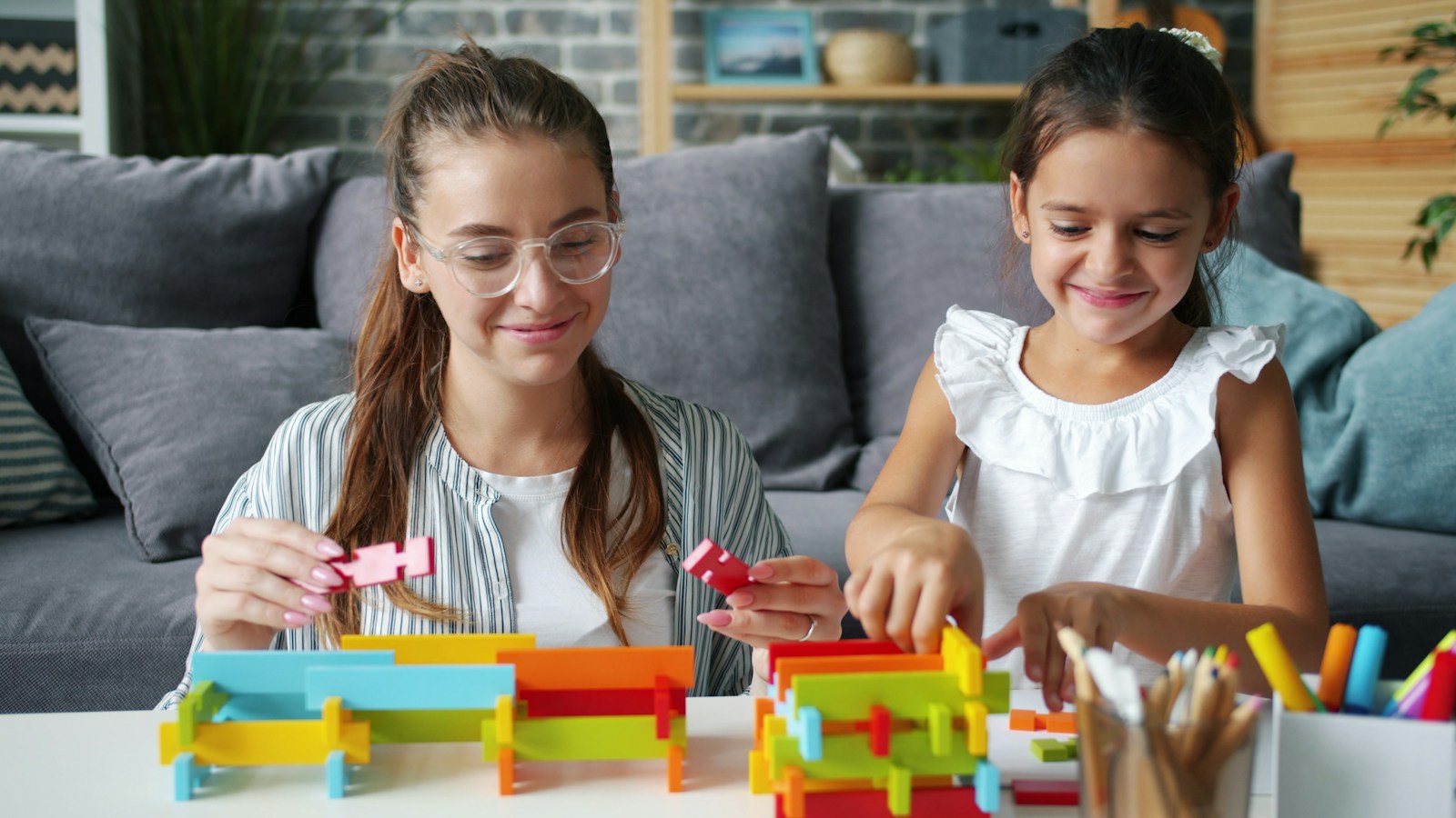 Children building with colourful blocks
